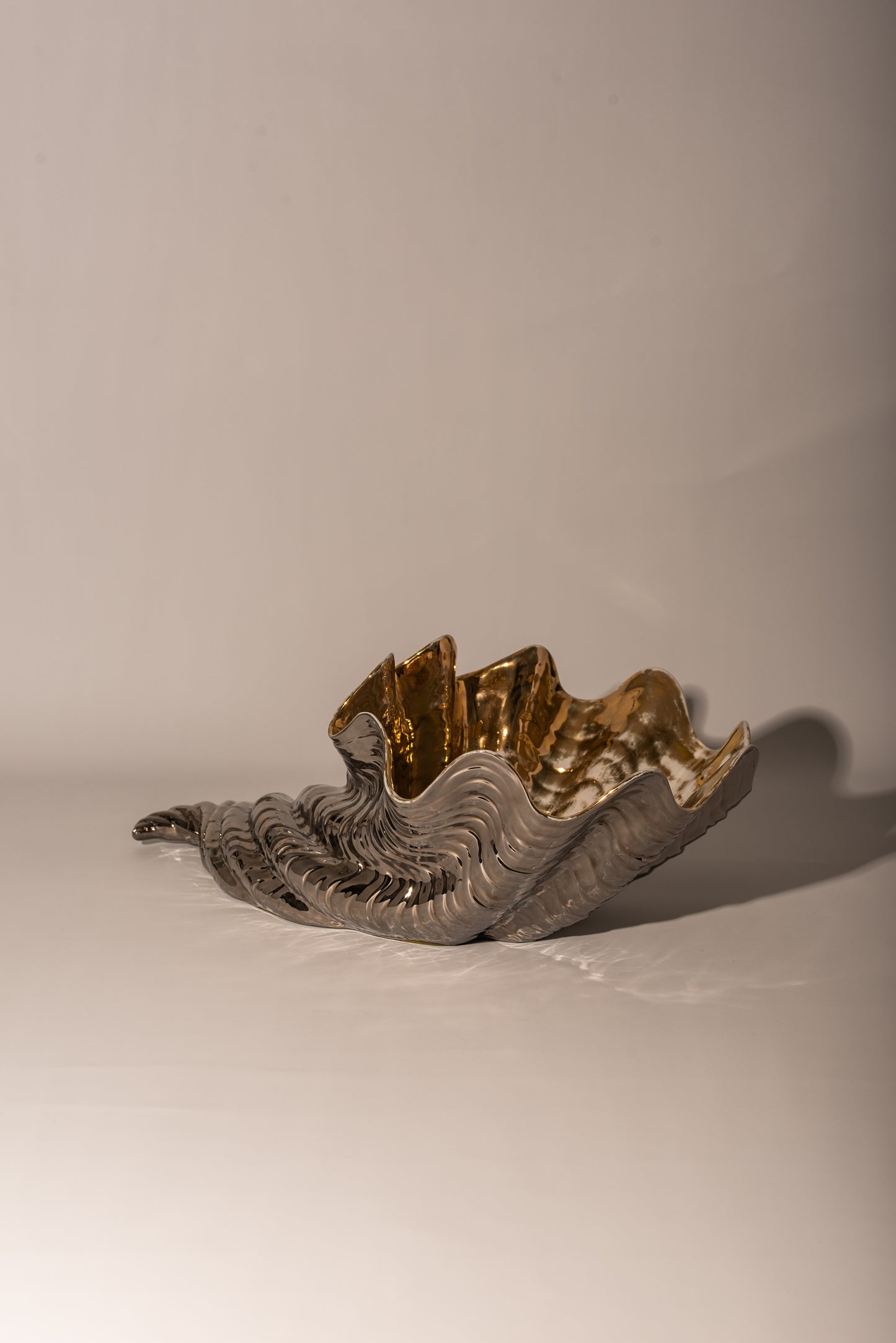 Shell shaped ceramic bowl