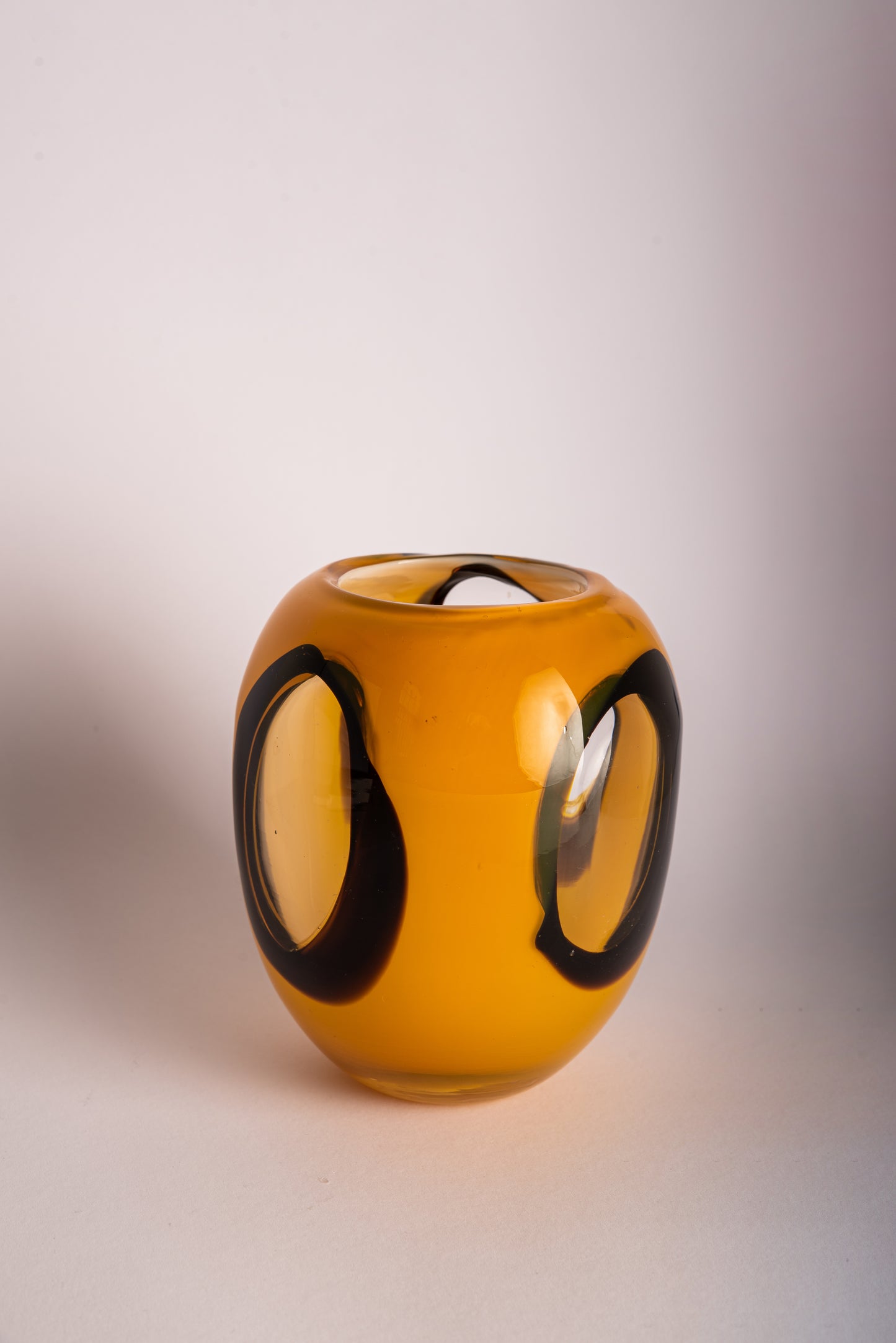 Orange, black and clear glass vase