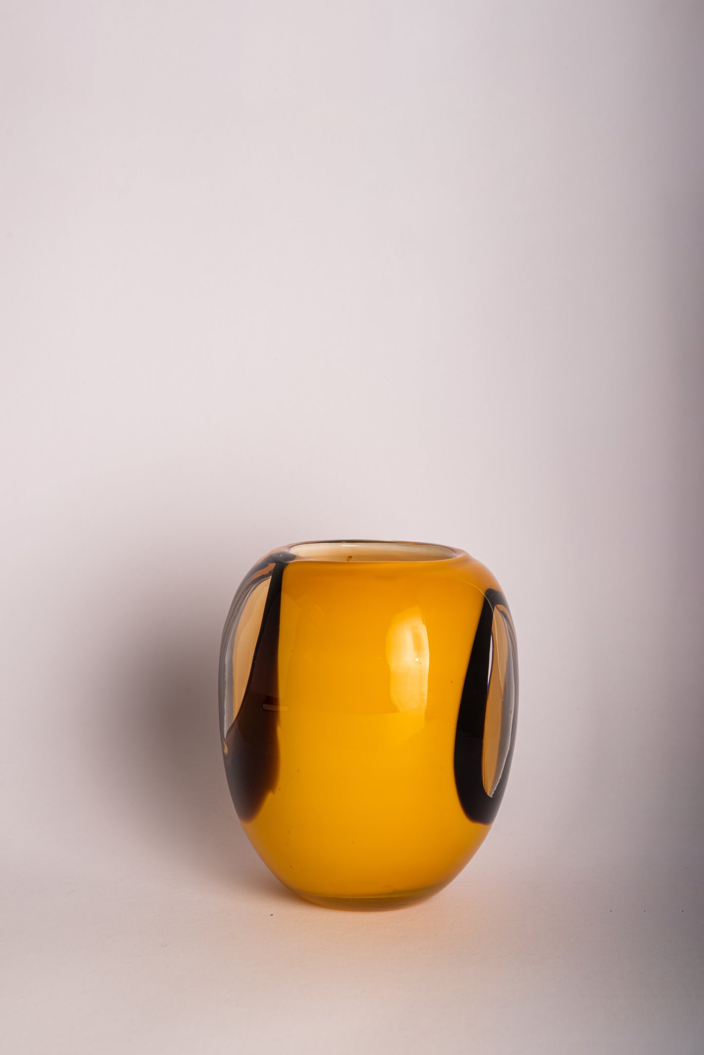 Orange, black and clear glass vase